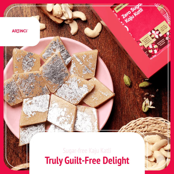 Sugar-free kaju katli on a pink plate with cashews and a red box labeled 'Zero Sugar Kaju Katli' on a wooden surface.